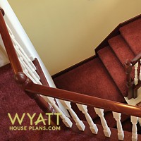 sweeping staircase, elegant banister, stair details, basement stairs, light-filled stairwell