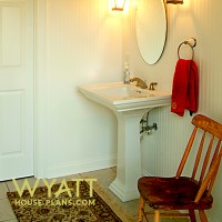 classy powder room, elegant bathroom, simple powder room ideas, top shelf, pedestal sink, bead board, display shelf